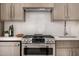 Modern kitchen featuring stainless steel appliances and sleek wooden cabinets at 8038 E Clarendon Ave, Scottsdale, AZ 85251