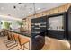 Modern kitchen with a large island, stainless steel appliances, and custom cabinetry at 8038 E Clarendon Ave, Scottsdale, AZ 85251