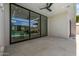 Covered patio space with ceiling fan, seamlessly flowing from indoor living to outdoor enjoyment at 8038 E Clarendon Ave, Scottsdale, AZ 85251