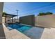 Sparkling pool featuring integrated spa and modern design with lush landscaping at 8038 E Clarendon Ave, Scottsdale, AZ 85251