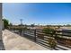 Spacious rooftop deck with modern black railing, offering panoramic city views at 8038 E Clarendon Ave, Scottsdale, AZ 85251