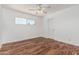 Bright bedroom with wood floors, neutral walls and a sunlit window, creating a peaceful retreat at 8315 E Vernon Ave, Scottsdale, AZ 85257