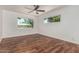 Bright bedroom with dark wooden floors and large windows that provide plenty of natural light at 8315 E Vernon Ave, Scottsdale, AZ 85257