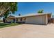 Charming single-story home with a two-car garage and spacious driveway, perfect for suburban living at 8315 E Vernon Ave, Scottsdale, AZ 85257