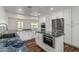 Bright kitchen with white cabinetry, stainless steel appliances, blue granite countertops, and an open design at 8315 E Vernon Ave, Scottsdale, AZ 85257