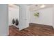 Bright laundry room with modern washer and dryer units and dark, wooden floors at 8315 E Vernon Ave, Scottsdale, AZ 85257