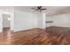 Spacious living room with stunning floors, light walls and ceiling fan offering versatility in design at 8315 E Vernon Ave, Scottsdale, AZ 85257