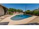 Beautiful backyard pool with lush greenery and plenty of space for relaxation at 8315 E Vernon Ave, Scottsdale, AZ 85257