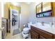 Cozy bathroom with tile flooring, wooden vanity, and a shower at 8532 E Sheridan St, Scottsdale, AZ 85257