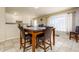 Cozy dining area with a table set, tile floors, and natural light from a window at 8532 E Sheridan St, Scottsdale, AZ 85257