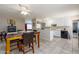 Open dining area with modern table set, tile floors, and adjoins the kitchen at 8532 E Sheridan St, Scottsdale, AZ 85257