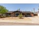 Charming single-story home with a well-maintained front yard and solar panels on the roof at 8532 E Sheridan St, Scottsdale, AZ 85257