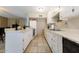Functional kitchen with ample cabinet space, tile floors, and essential appliances at 8532 E Sheridan St, Scottsdale, AZ 85257