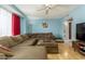Inviting living room features a spacious sectional, ceiling fan, and hardwood floors at 8532 E Sheridan St, Scottsdale, AZ 85257
