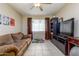 Living room with a sofa, entertainment center, and tile floors at 8532 E Sheridan St, Scottsdale, AZ 85257