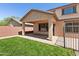 The backyard features an inviting covered patio with ample space for outdoor seating and relaxation at 9051 W Iona Way, Peoria, AZ 85383