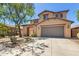 Beautiful two-story home with a well-kept lawn and landscaping, featuring a spacious driveway at 9051 W Iona Way, Peoria, AZ 85383