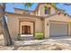 Charming two-story home with a covered entry, low maintenance landscaping, and attached garage at 9051 W Iona Way, Peoria, AZ 85383