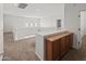 Bright hallway with plush carpet, white railing, and white walls at 9051 W Iona Way, Peoria, AZ 85383