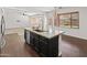 Beautiful kitchen island featuring a granite countertop and stainless steel dishwasher at 9051 W Iona Way, Peoria, AZ 85383