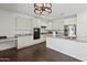 Modern kitchen featuring granite countertops, stainless appliances, and ample cabinet space at 9051 W Iona Way, Peoria, AZ 85383