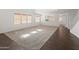 Open concept living space featuring lots of natural light and hardwood flooring at 9051 W Iona Way, Peoria, AZ 85383