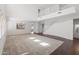 Bright, open living room with plush carpet, hardwood floors, and a high ceiling at 9051 W Iona Way, Peoria, AZ 85383