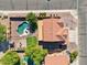 An aerial view of a backyard that includes a private swimming pool and well-maintained turf at 941 E Stirrup Ln, San Tan Valley, AZ 85143
