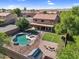 Serene backyard with a freeform pool, cozy seating, and beautifully landscaped areas at 941 E Stirrup Ln, San Tan Valley, AZ 85143