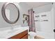 Bathroom featuring a shower-tub, vanity with a large mirror, and stylish floating shelves at 941 E Stirrup Ln, San Tan Valley, AZ 85143