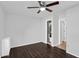 Spacious bedroom with sleek wood floors, a modern ceiling fan and ensuite bath at 941 E Stirrup Ln, San Tan Valley, AZ 85143
