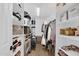 Walk-in closet offering extensive shelving, hanging space and storage solutions at 941 E Stirrup Ln, San Tan Valley, AZ 85143