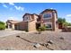 Beautiful two-story home with a three-car garage and drought-resistant landscaping in a residential neighborhood at 941 E Stirrup Ln, San Tan Valley, AZ 85143