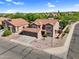 Charming two-story home with a terracotta tile roof and a spacious three-car garage at 941 E Stirrup Ln, San Tan Valley, AZ 85143