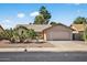 Charming single story home featuring a two car garage and mature desert landscaping at 9839 W Utopia Rd, Peoria, AZ 85382