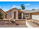 Charming single story home featuring desert landscaping and a beautiful wrought iron door at 9839 W Utopia Rd, Peoria, AZ 85382