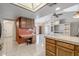 Open-concept kitchen with a study area, bright lighting, and easy access to other living spaces at 9839 W Utopia Rd, Peoria, AZ 85382