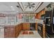 An inviting kitchen with warm wood cabinetry, bright lighting, and modern appliances is ready for cooking at 9839 W Utopia Rd, Peoria, AZ 85382