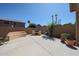 Backyard with a BBQ grill, patio seating, desert landscaping, and a block wall at 10465 E Knowles Ave, Mesa, AZ 85209