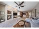 Inviting living area with a cozy fireplace and built-in shelving, perfect for relaxation at 10465 E Knowles Ave, Mesa, AZ 85209