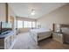 Serene main bedroom with abundant natural light and stylish furnishings at 10465 E Knowles Ave, Mesa, AZ 85209