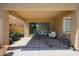 View of a covered patio with ample seating and view of the backyard at 10465 E Knowles Ave, Mesa, AZ 85209