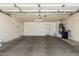 Spacious garage with concrete flooring, white walls, and plenty of room for parking and storage at 1063 W Vaughn St, Tempe, AZ 85283