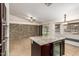 Open concept kitchen has granite counters, stainless appliances, an island with a drink fridge, and a breakfast nook at 1063 W Vaughn St, Tempe, AZ 85283