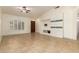 An open-concept room with tile flooring, an arched window, and a built-in media center at 1063 W Vaughn St, Tempe, AZ 85283