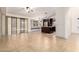 An open-concept room with tile flooring, an arched window, and access to the kitchen at 1063 W Vaughn St, Tempe, AZ 85283