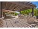 Spacious outdoor kitchen and entertainment area with a built-in grill and stone accents at 1063 W Vaughn St, Tempe, AZ 85283