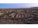 Drone shot of the neighborhood highlighting a home location in a desert community with mountain views at 1123 W Thunderhill Dr, Phoenix, AZ 85045