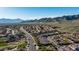 Aerial view of the community highlighting well-maintained streets and mountain views on a clear day at 1123 W Thunderhill Dr, Phoenix, AZ 85045