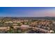 Serene aerial view of a neighborhood, lush golf course, and retail area at 1123 W Thunderhill Dr, Phoenix, AZ 85045